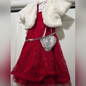 Elegant Red Dress with White Shrug and Silver Bag